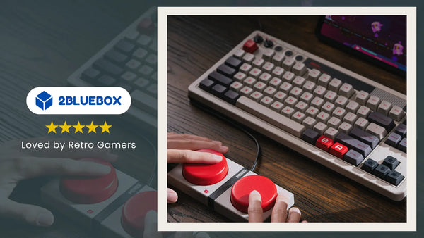 Retro gaming accessories on desk: mechanical keyboard and arcade-style controller used for modern retro setups