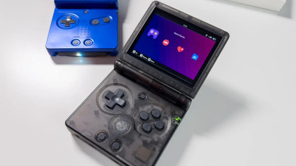 Side-by-side comparison of the clamshell Anbernic RG35XX SP handheld and the dual-stick 2Bluebox R36S console