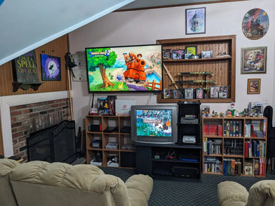 Two players enjoying classic arcade games on a living room 4K TV with wireless controllers