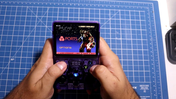 R36S handheld console running a classic PC port through PortMaster on its 3.5-inch IPS screen
