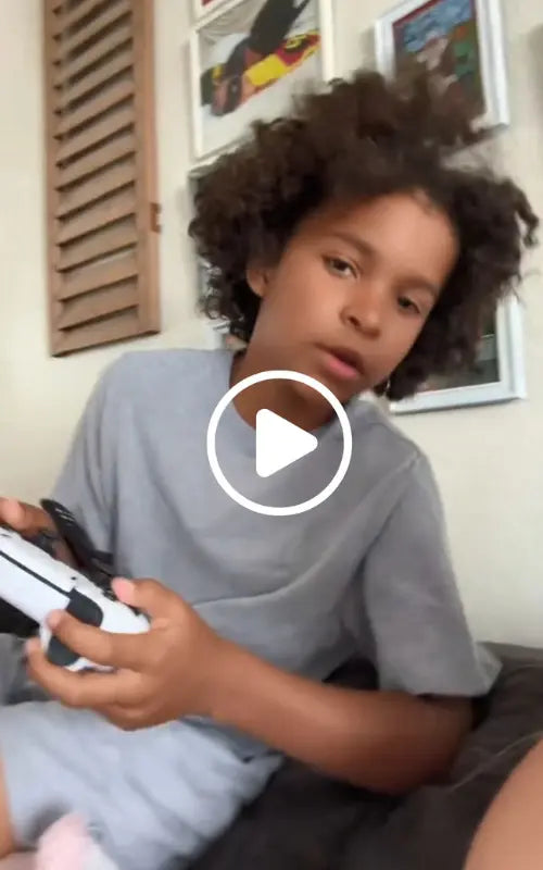 Child playing 2Bluebox Gaming Console