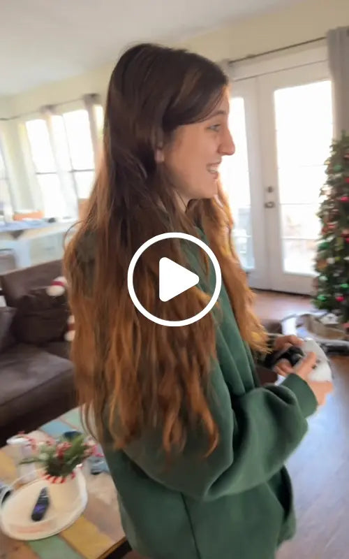 Woman is playing 2Bluebox Retro Game Console on living room