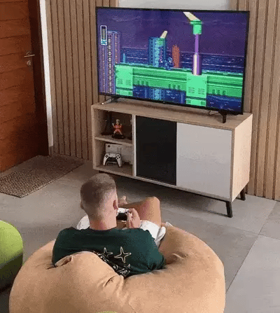 2Bluebox Game Stick Pro Customer is playing retro video game on TV GIF