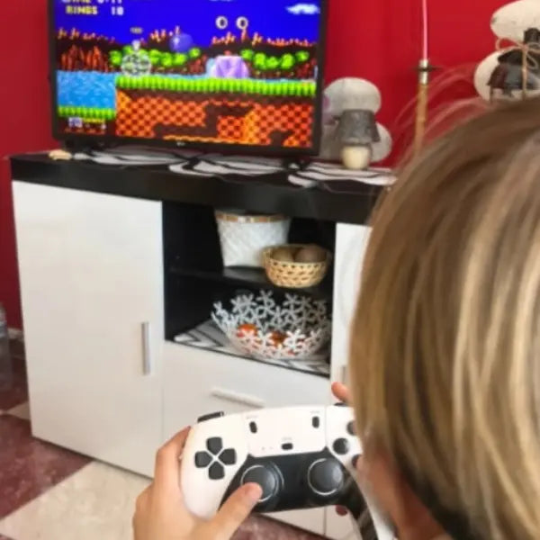 Person playing Sonic Game on a television with 2Bluebox Retro Game Console