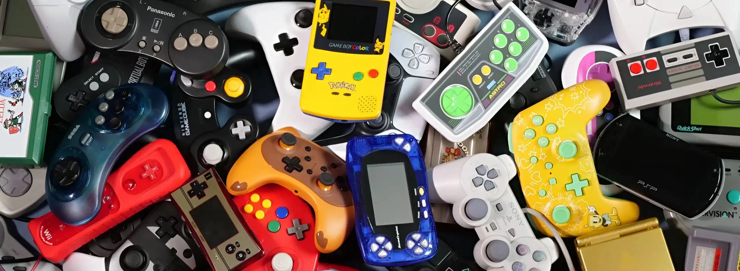 Collection of various vintage gaming controllers and handheld devices.