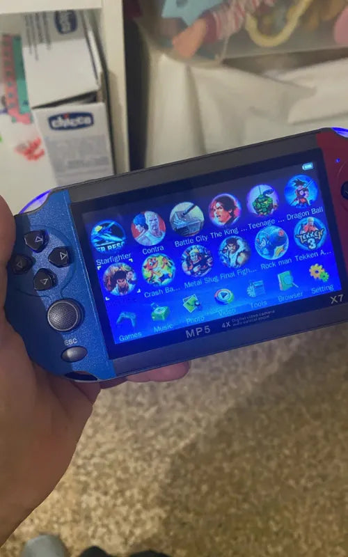 Close-up of X7 Handheld Console screen displaying game menu icons including Tekken 3 and Metal Slug.